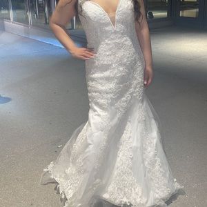 Selling my wedding dress, lace all over the top an mid section of the dress.